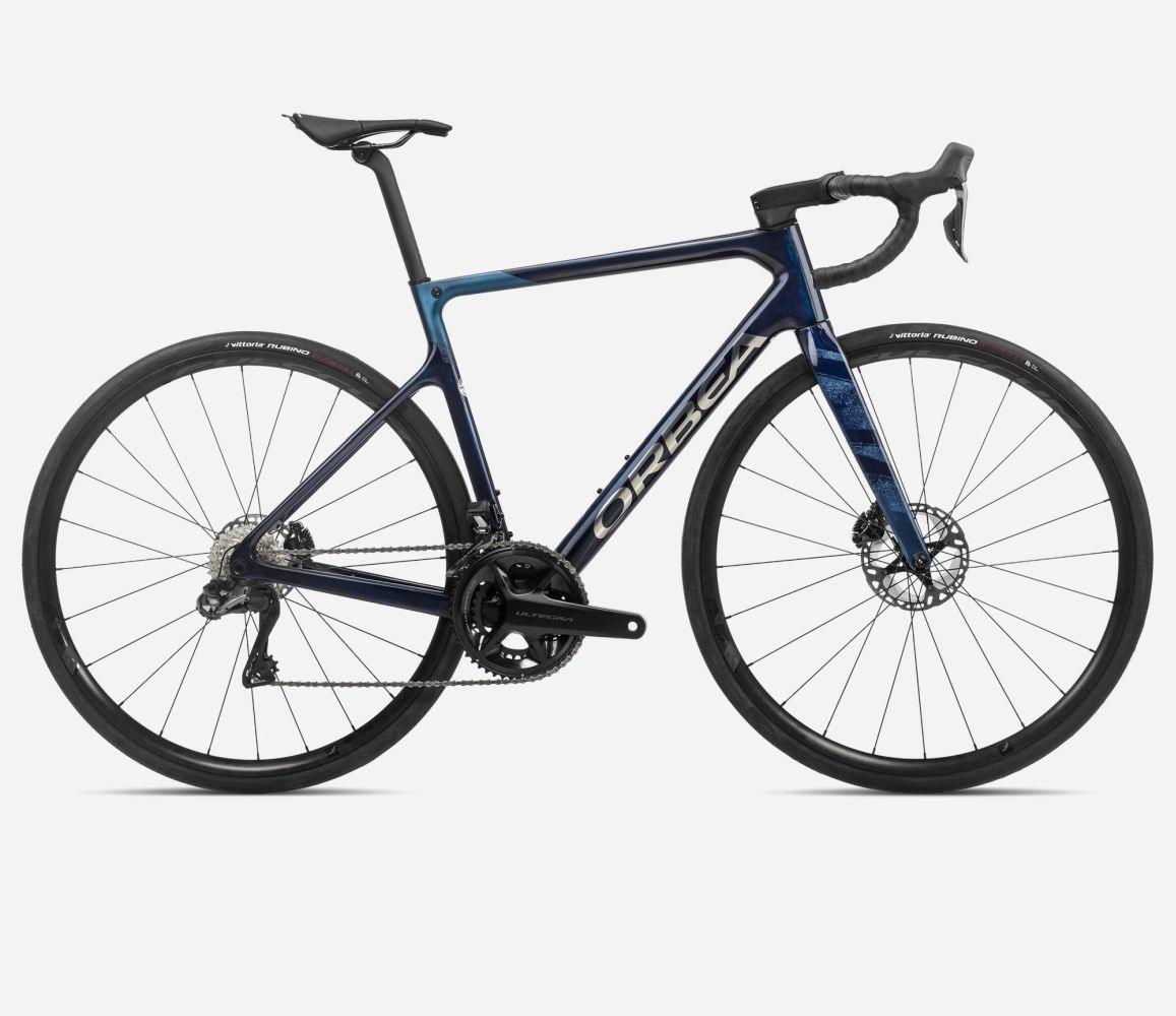 orbea-orca-m20iteam-blue-carbon-view-titan-2023-liquid-life-36763498053941.jpg Orbea Orca M20ITeam Blue Carbon View - Titan – Image 1